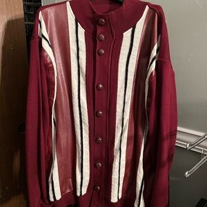The sweater is more of a burgundy/with white and black